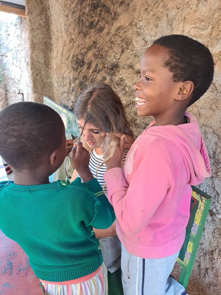 A traveler with children at a community classroom