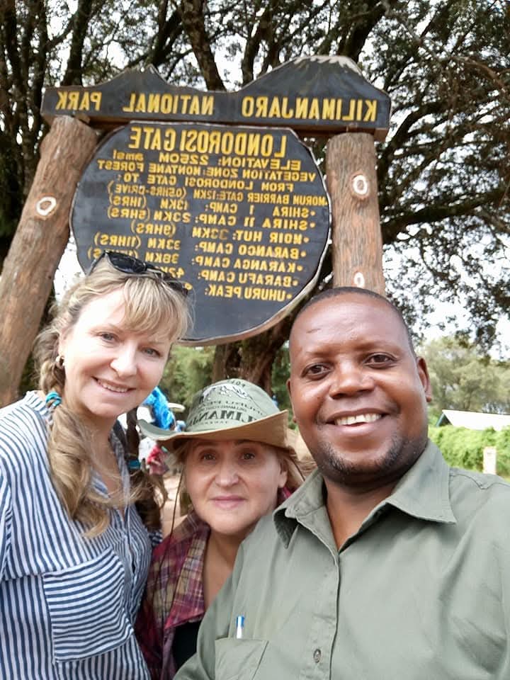 Guide and guests at the Londorosi Gate, Kilimanjaro National Park